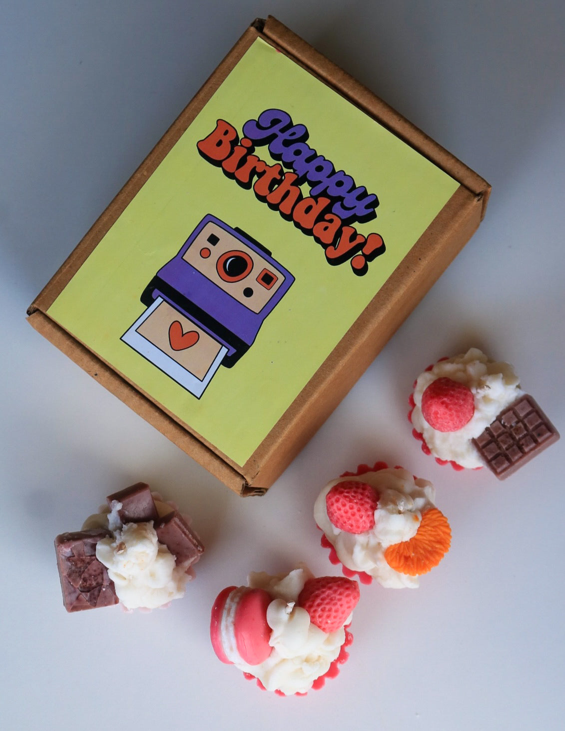 Set of four cupcake candles, birthday box