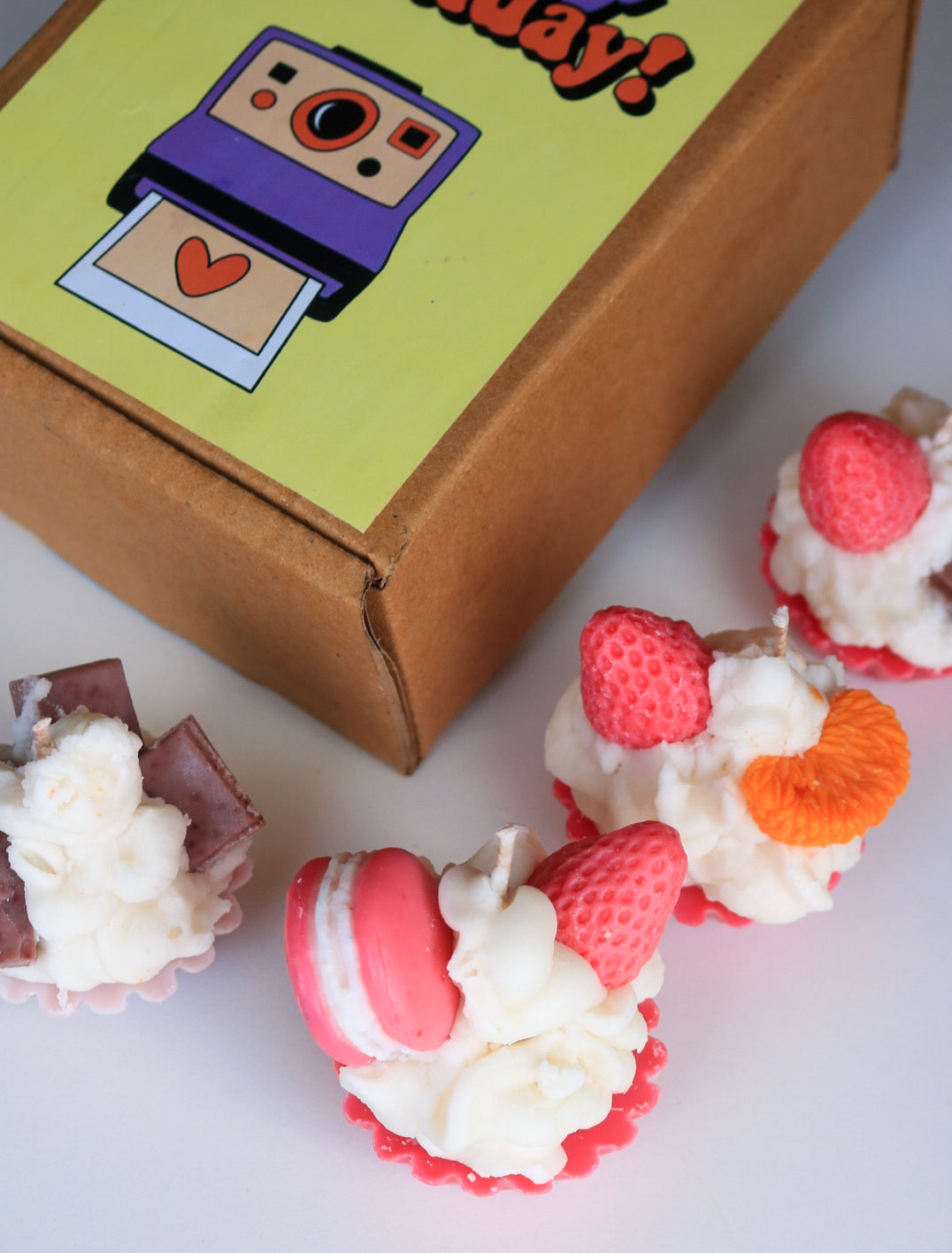 Set of four cupcake candles, birthday box